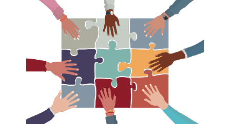 multi-colored hands on a multicolored jigsaw puzzle